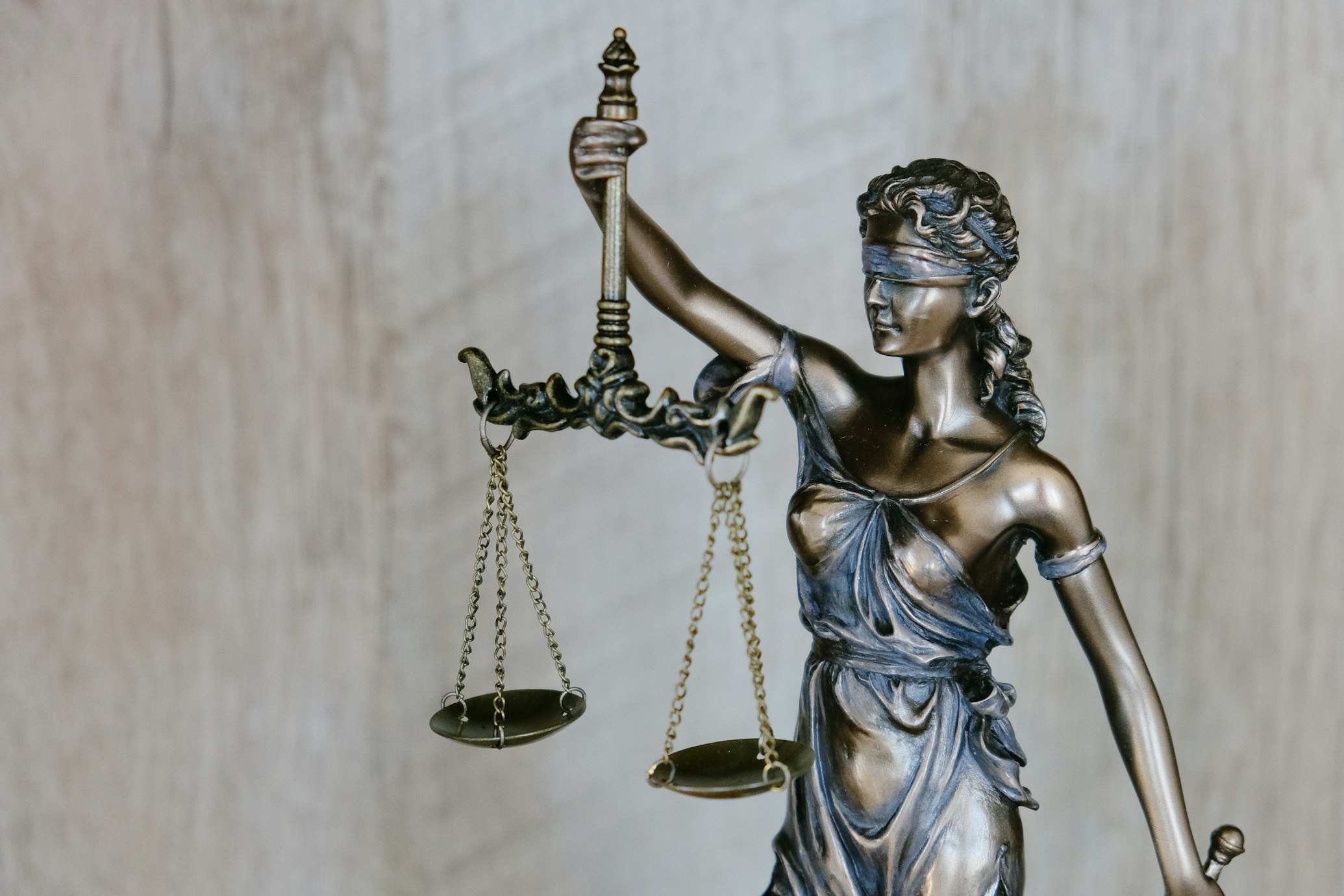 Lady Justice statue representing fair access to legal help